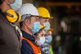Nouryon employees with protective hard hats